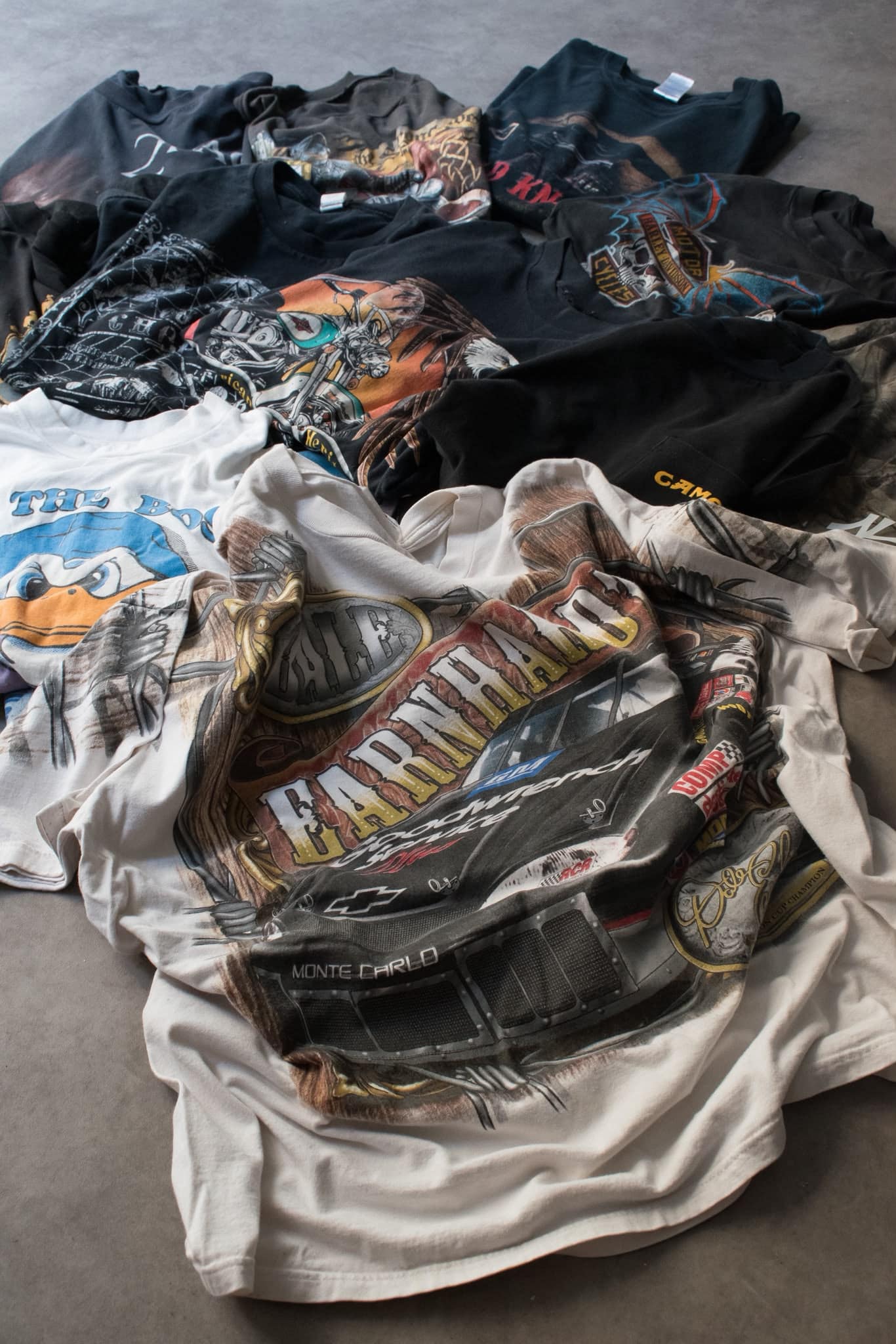 Pile of curated vintage graphic t-shirts at Fabricsonder